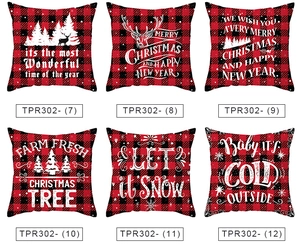 Close-up of red and black buffalo plaid Christmas pillow covers with festive white patterns