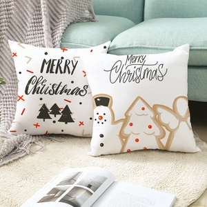 Set of two Christmas pillow covers with Merry Christmas lettering and festive cartoons