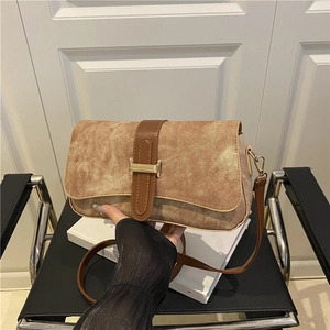 Vintage khaki washed canvas shoulder bag with brown leather strap and gold H-buckle detail