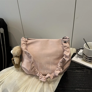 Pink cartoon print tote bag with ruffled shoulder strap and plush bear charm