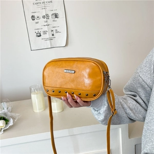 Summer yellow crossbody bag with metal rivets and adjustable strap for casual daily use