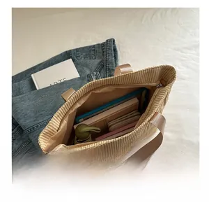 Interior view of large woven tote bag showing capacity for tablet, umbrella and wallet