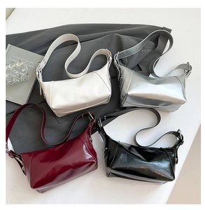 Top view of large capacity PU leather underarm bags in white, silver, red, and black