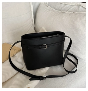 Detail of black lychee pattern bucket bag featuring silver buckle and FANYIBA logo