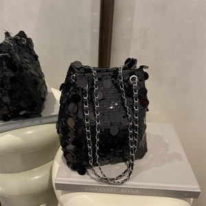 Fashionable black sequin bucket bag with silver chain strap for elegant party styling