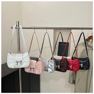 Detailed display of bow shoulder bags in six colors with elegant leather pleats