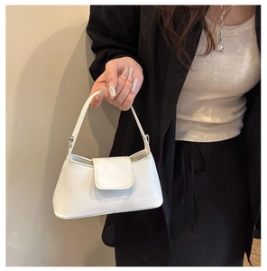 Close-up of minimalist white leather handbag with FANYISSA logo and silver hardware detail