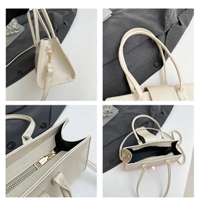 Vue détaillée du sac à main blanc crème motif croco avec détails dorés et doublure