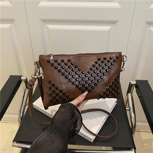 Retro dark brown crossbody envelope bag with V-shaped rivets and adjustable strap