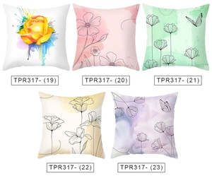 Detail view of five peach skin pillow covers featuring various watercolor floral prints