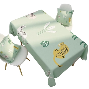 Linen table cloth with leopard and palm leaf pattern including matching cushions