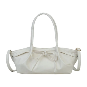 Minimalist cream white PU leather tote bag with elegant bow detail and thin shoulder strap