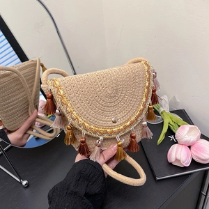 Ethnic straw woven envelope bag with colorful tassels and metallic wave trim detail