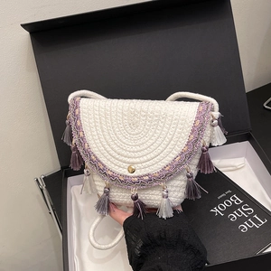 Handmade white woven crossbody bag with purple floral embroidery and silk tassels