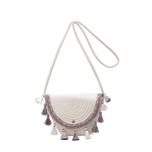 Summer straw crossbody bag with half-round flap and colorful tassels for beach vacation