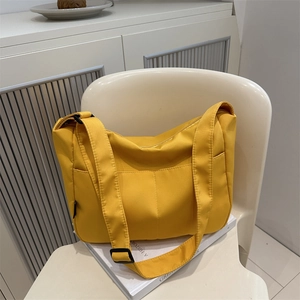 Bright yellow nylon crossbody bag with adjustable strap for daily casual street fashion