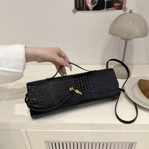 Black crocodile pattern rectangular handbag with elegant gold knot clasp and shoulder strap