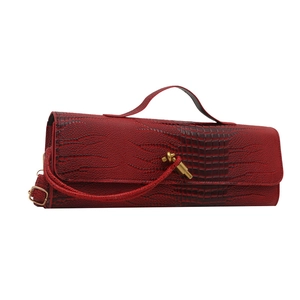 Dark red crocodile embossed faux leather baguette bag with top handle and gold knot detail