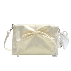 Chic cream bow shoulder bag with pleats and pearl charm in balletcore style
