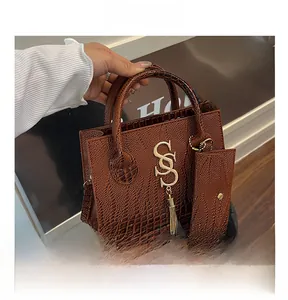 Brown crocodile texture handbag with small matching pouch and gold letter pendant details