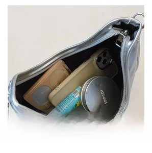 Top view detail of the silver metallic bag interior showing large capacity for essentials