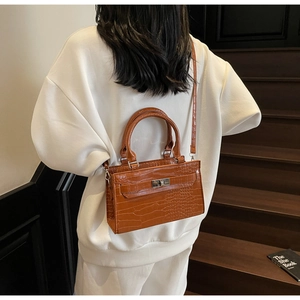 Brown crocodile embossed leather Kelly style bag with metal lock and handle detail