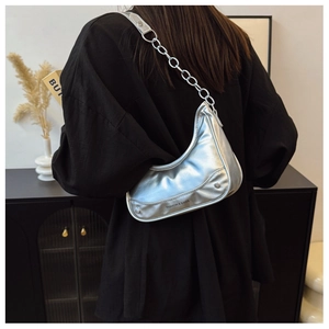 Detail of silver metallic crescent bag showing the Fashion & Bags logo and chain strap