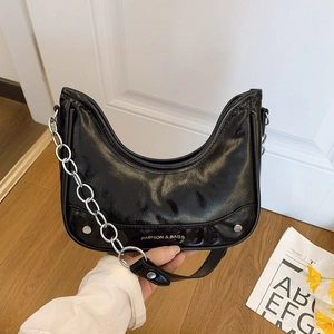 Chic black hobo shoulder bag with silver chain and white lettering on shiny leather