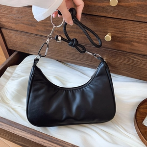 Minimalist black crescent shoulder bag with silver rings and knotted leather strap