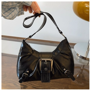Detail view of black faux leather shoulder bag with vintage silver buckle hardware