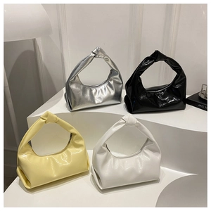 Minimalist hobo bags in silver, black, yellow and white with stylish knot handle detail