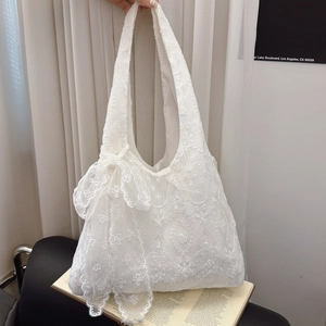 Elegant white lace tote bag with floral embroidery and bow detail in French style