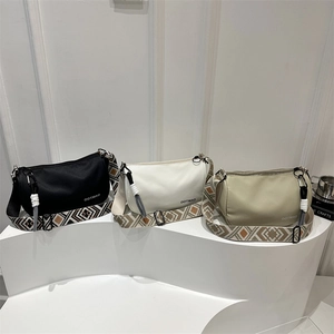 Minimalist Boston crossbody bag with wide jacquard strap in black, white, and green