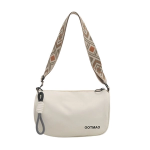 Minimalist white canvas Boston bag with geometric wide strap and tassel detail