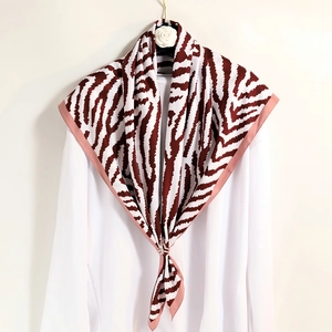 Brown zebra leopard print square silk scarf with purple border on a white shirt