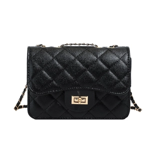 Classic black quilted leather crossbody bag with gold chain strap and turn-lock closure