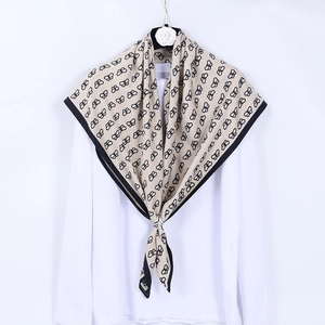 Elegant 90cm square silk scarf featuring butterfly print and black border on beige fabric
