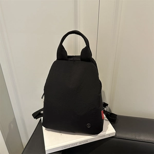Mini sac à dos noir polyvalent pour femme en nylon avec poignée et logo mode