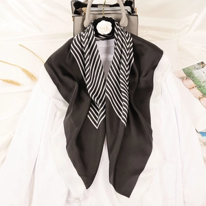 Elegant striped silk square scarf for women styled with handbag and wheat decor