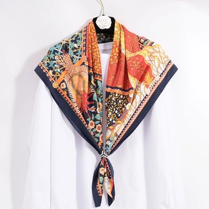 Luxurious colorful silk square scarf with floral print and Paris motif on white shirt
