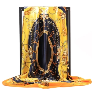 Baroque chain print satin silk scarf 90x90cm in yellow and black on display stand
