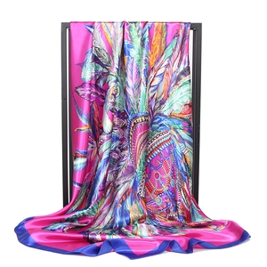 Satin square headscarf featuring vibrant pink feather patterns and navy blue edges
