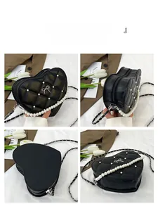 Detail of heart-shaped black crossbody bag with quilted PU leather and pearl chain strap