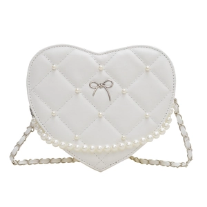 White heart-shaped quilted handbag with pearl accents and metal bow detail