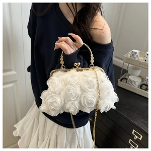 Detail of 3D chiffon rose floral evening clutch bag with gold chain and clasp handle