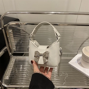 Mini white crossbody bag for girls with silver bow and elegant chain strap