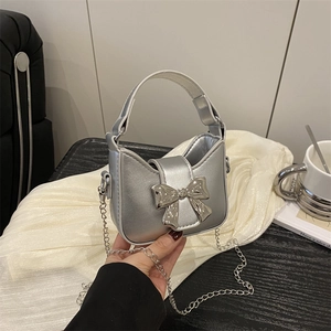 Silver metallic mini handbag with bow detail and chain strap for girls and women