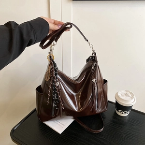 Retro large capacity dark brown tote bag with decorative tassel and golden pendant