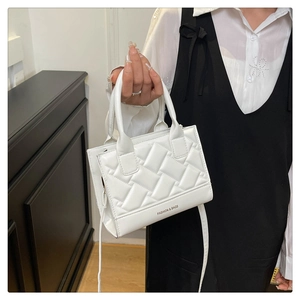 Close-up of white quilted PU leather handbag with Fashion & Bags text and crossbody strap
