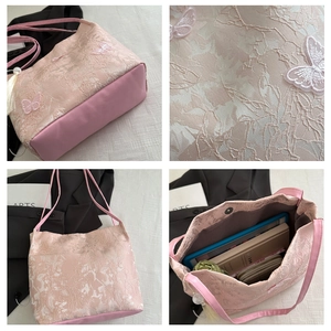 Detail of pink butterfly embroidery and large capacity interior of this chic tote bag